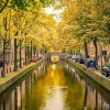 Best Brug over een kanaal in Amsterdam fotobehang Steden | Architectuur