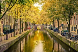 Best Brug over een kanaal in Amsterdam fotobehang Steden | Architectuur