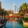 Hot Burj Al Arab met palmbomen op de voorgrond fotobehang Steden | Architectuur
