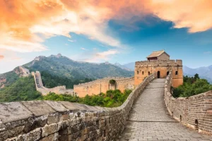 Online De Chinese Muur bij zonsondergang fotobehang Architectuur