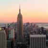Outlet De Skyline van New York bij zonsondergang fotobehang Architectuur