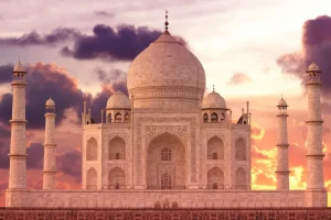 Online De Taj Mahal bij zonsondergang fotobehang Architectuur