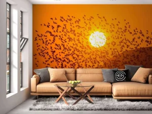 Discount Grote groep vogels bij zonsondergang fotobehang Dieren