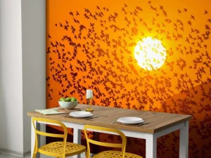 Discount Grote groep vogels bij zonsondergang fotobehang Dieren