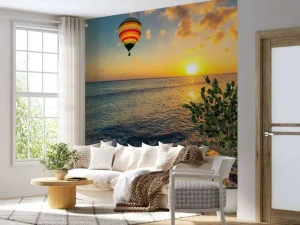 Clearance Luchtballon boven zee bij zonsondergang fotobehang Transport