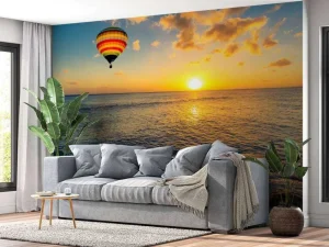 Clearance Luchtballon boven zee bij zonsondergang fotobehang Transport