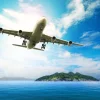 Best Passagiersvliegtuig boven een tropische zee fotobehang Tienerkamer | Transport
