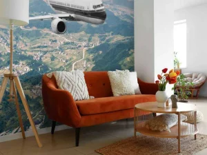 Hot Passagiersvliegtuig boven een berglandschap fotobehang Transport