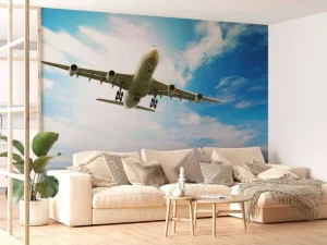 Best Passagiersvliegtuig boven een tropische zee fotobehang Tienerkamer | Transport