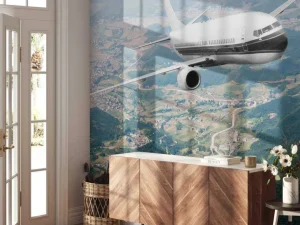 Hot Passagiersvliegtuig boven een berglandschap fotobehang Transport