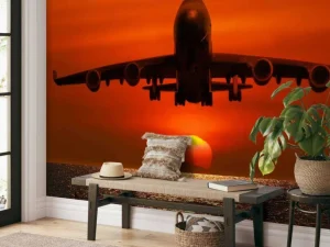 Best Passagiersvliegtuig boven de zee bij zonsondergang fotobehang Transport