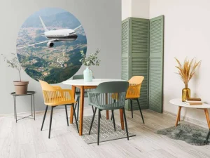Hot Passagiersvliegtuig boven een berglandschap fotobehang Transport