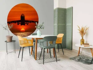 Best Passagiersvliegtuig boven de zee bij zonsondergang fotobehang Transport