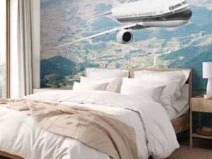 Hot Passagiersvliegtuig boven een berglandschap fotobehang Transport