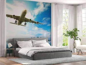 Best Passagiersvliegtuig boven een tropische zee fotobehang Tienerkamer | Transport