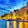 Best Rivier de Amstel in de avond fotobehang Steden | Architectuur