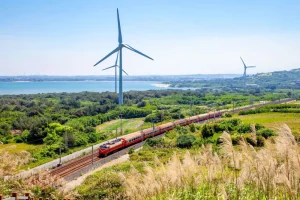 Online Rode trein langs windmolens fotobehang Transport