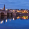 Discount Sint Servaasbrug in de avond fotobehang Architectuur