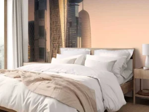Discount Skyline van Doha in de avond fotobehang Architectuur