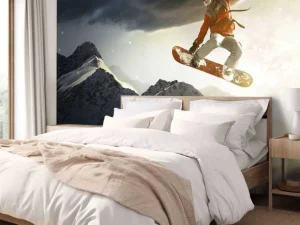 Hot Snowboarder maakt een sprong bij zonsondergang fotobehang Tienerkamer | Sport
