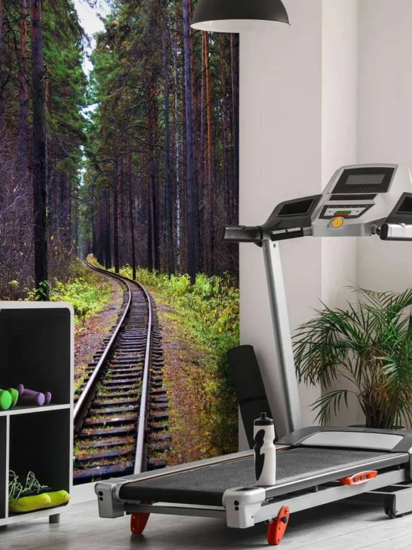 Discount Spoorlijn door een bos fotobehang Transport