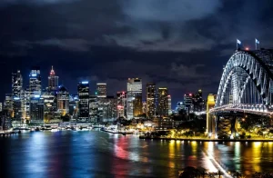 Sale Sydney in de avond fotobehang Architectuur