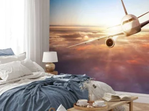 Hot Vliegtuig boven de wolken bij zonsondergang fotobehang Transport