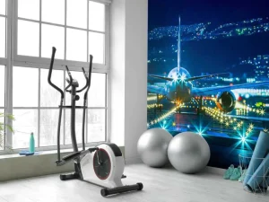 Online Vliegtuig op een verlicht vliegveld fotobehang Tienerkamer