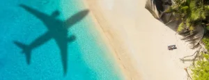 Outlet Vliegtuig schaduw op een tropisch strand fotobehang Transport